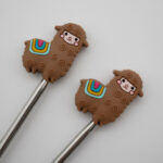 Knitting Margot stitch stoppers - llamas brown