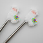 Knitting Margot stitch stoppers - llamas white