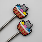 Knitting Margot stitch stoppers - sleeping cats