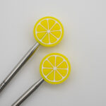 Knitting Margot stitch stoppers - citron
